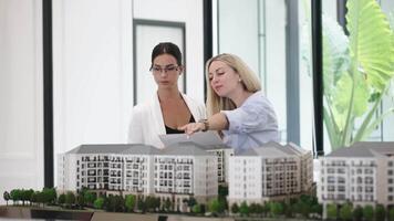 Professional architect engineer team. Interior designer discussing about building exterior designing. Engineer Discussing New Real Estate Project Construction video