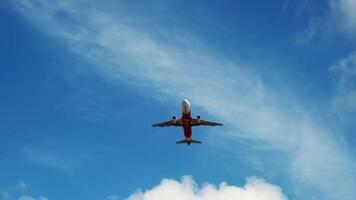 Tracking Shot of White Passenger Civil Airplane Flying Above the Clouds in Bright Sunny Day. Top View. video