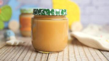 baby food in a container on table with copy space. video