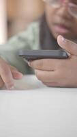 A Childs Hand Skillfully Using a Smartphone with a Focused and Engaging Gesture video