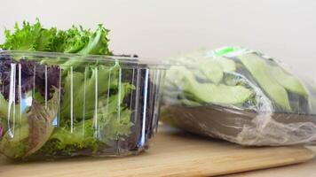 Fresh, vibrant vegetables arranged in packaging displayed on a wooden surface video