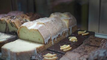 A beautiful bakery display of cakes and pastries that delights all video