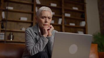 Senior Woman Deep in Thought While Using Laptop video