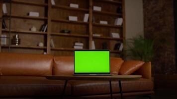 Laptop with Green Screen Chroma Key on Wooden Table in Office video