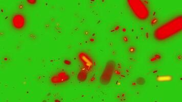 Flickering sparks on a green background uniquely convey the atmosphere of romance and the warmth of a fire. video