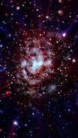 A scarlet, pearlescent voluminous galaxy rotates in space, emitting streams of plasma. video