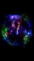 Spherical abstraction of cosmic energy. A sphere of multi-colored particles, permeated with threads of energy. video