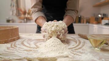 A person is mixing flour on a table video