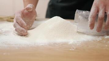 A person is mixing flour on a table video