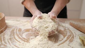 A person is mixing flour on a table video