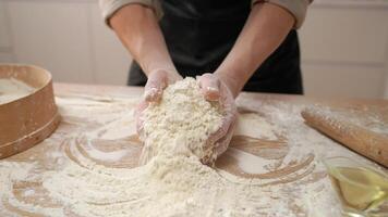 A person is mixing flour on a table video