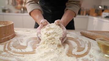 A person is mixing flour on a table video