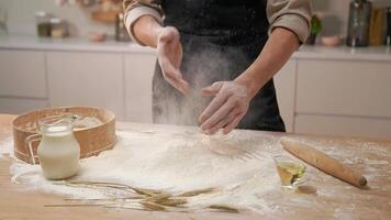 A person is mixing flour on a table video