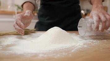 A person is mixing flour on a table video