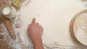 A person is touching flour on a table video