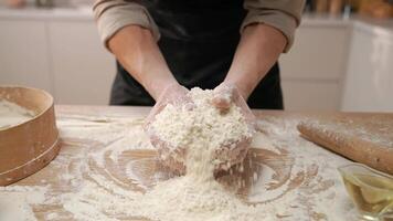 A person is mixing flour on a table video
