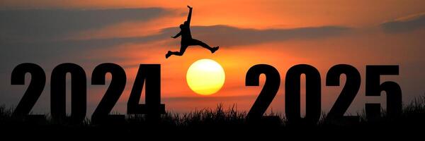 A person jumping into the air with the sun setting behind them photo