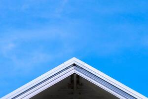 Minimalist Architectural Roof Against Clear Blue Sky Capturing Modern Design and Simplicity in Urban Environments photo