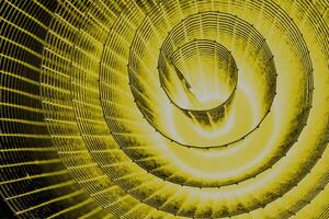 Abstract spiral with glowing yellow wire texture against a black background, symbolizing color contrast, energy, motion, industrial and futuristic design concepts. Copy space photo