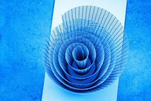 Abstract artistic geometric spiral wire mesh with detailed curves and shadows, suitable for abstract backgrounds, geometric design, and creative photography projects. Copy space photo