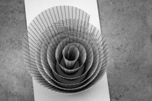 Abstract artistic geometric spiral wire mesh with detailed curves and shadows, suitable for abstract backgrounds, geometric design, and creative photography projects. Copy space photo