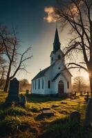 A serene church stands in a graveyard, illuminated by the warm glow of the setting sun. photo