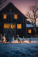 Geese walking in snow near a rustic barn during sunset with warm glowing windows. photo