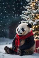 A panda in a red scarf sits by a snow-covered Christmas tree, creating a festive atmosphere. photo