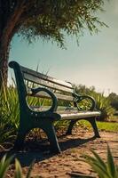 A serene park bench under a tree, inviting relaxation in a natural setting. photo