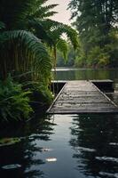 A serene wooden dock surrounded by lush greenery and calm waters. photo