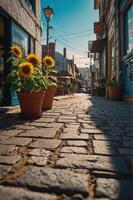 A charming cobblestone alley adorned with sunflowers in pots under a bright sky. photo