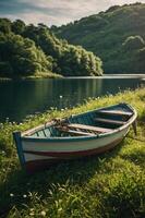 A rustic boat resting on a grassy bank by a serene river surrounded by lush greenery. photo