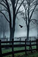 A misty graveyard scene with bare trees and a flying crow, evoking a haunting atmosphere. photo