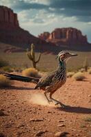 A roadrunner running across a dusty desert landscape with rocky formations in the background. photo