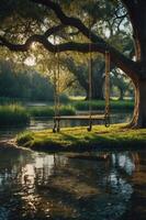 A serene swing hangs from a tree by a calm river, surrounded by lush greenery and sunlight. photo