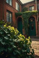 A charming courtyard with brick walls, green doors, and lush ivy creating a serene atmosphere. photo