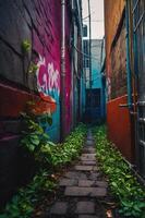 A narrow alleyway adorned with colorful graffiti and lush greenery. photo