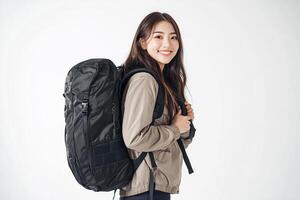 A woman with a backpack standing in front of a white background photo