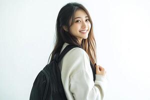 A young woman with a backpack smiling photo