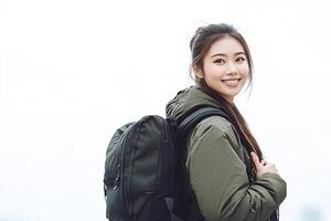 A woman with a backpack standing in front of a city photo