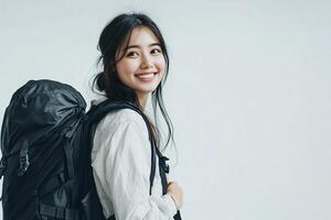 Portrait of asian woman with backpack on white background photo