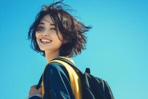 A woman with a backpack and a smile photo