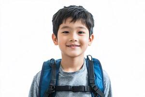 A young boy with a backpack smiling photo