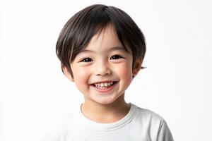 A little boy is smiling and posing for the camera photo