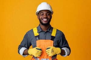 Portrait of a smiling african american construction worker isolated on orange background photo