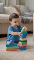 A baby boy playing with colorful blocks photo