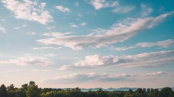 A view of the sky with clouds and trees photo