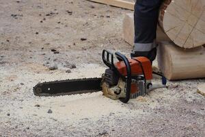Chainsaw Cutting Wood in Motion a dynamic display of skill and efficiency in woodworking photo