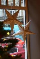 Decorative Paper Stars Designed for a Beautiful Holiday Window Display for All to Enjoy photo