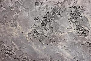 Textured Grey Wall Surface Featuring Unique Abstract Patterns and Creative Designs photo